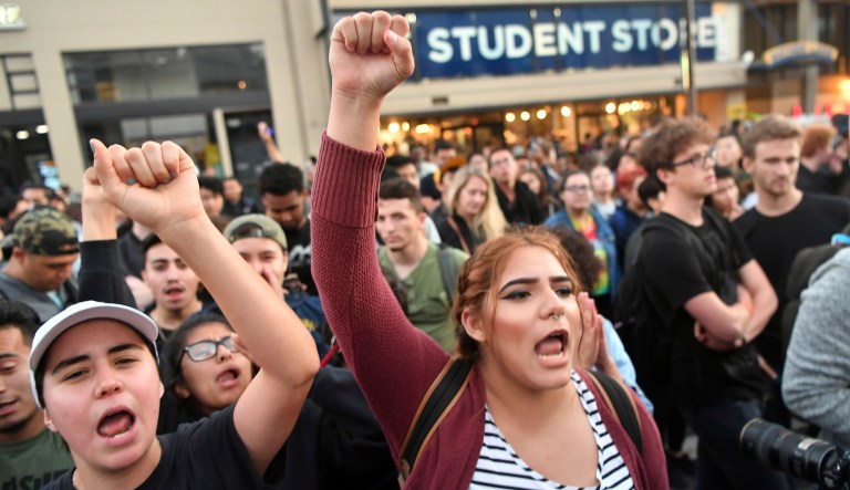 Protesters shout during a campus free speech rally. (AP Photo/Josh Edelson)