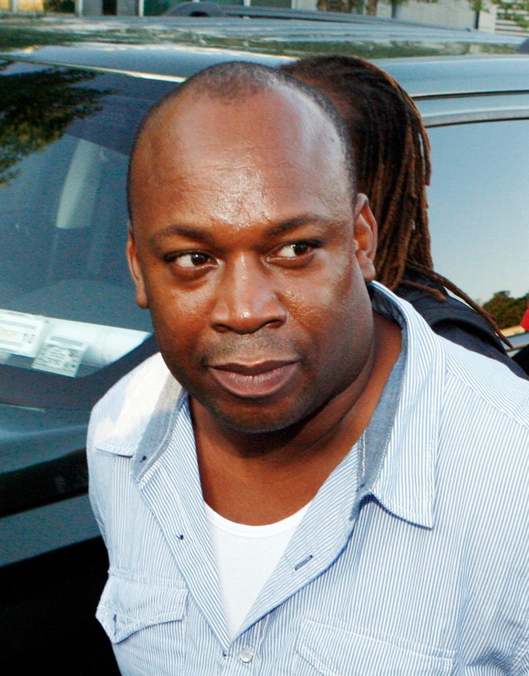   FILE - In this June 24, 2010 file photo, U.S. Drug Enforcement Administration agents bring Jamaican drug lord Christopher 