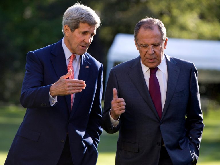 U.S. Secretary of State John Kerry, left, and Russian Foreign Minister Sergey Lavrov talk as they walk together on the grounds of the Chief of Mission Residence in Paris, France, Tuesday, Oct. 14, 2014. The top U.S. and Russian diplomats are hoping to find a way to begin reversing a yearlong spike in tensions stemming from Ukraine's revolution and civil war. (AP Photo/Carolyn Kaster, Pool)