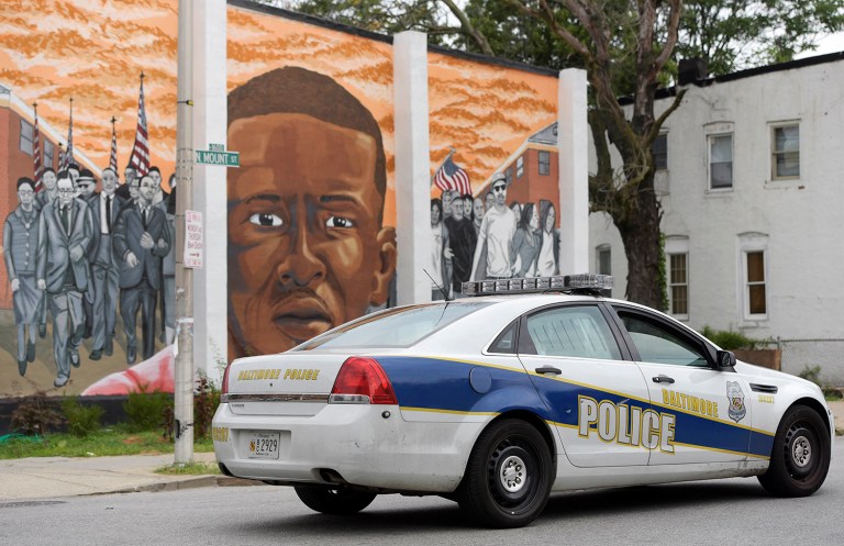Similar to Ferguson, the 2015 death of a young black man, Freddie Gray, while in police custody prompted calls for a federal investigation into the city's police. (AP Photo/Steve Ruark)