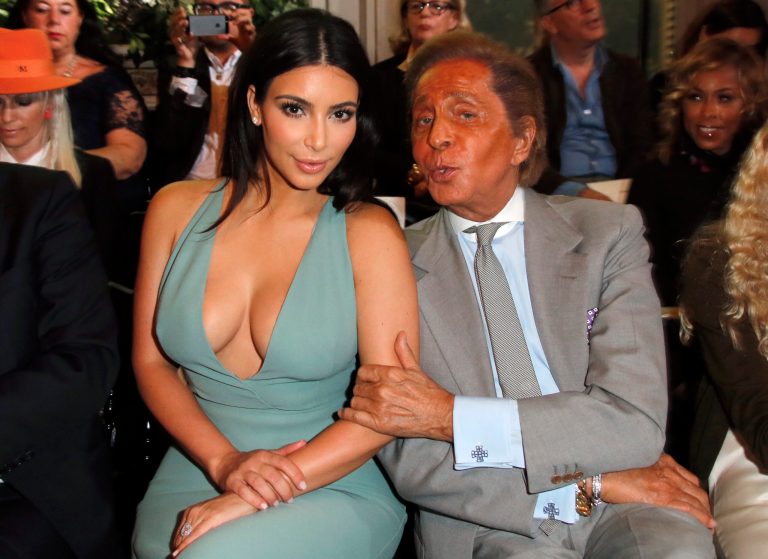 Kim Kardashian and fashion designer Valentino pose for photographers prior to the presentation of the Valentino Fall Winter 2014-15 Haute Couture fashion collection designed by Italian creative directors Maria Grazia Chiuri and Pierpaolo Piccioli, in Paris, Wednesday, July 9, 2014. (AP Photo/Francois Mori)