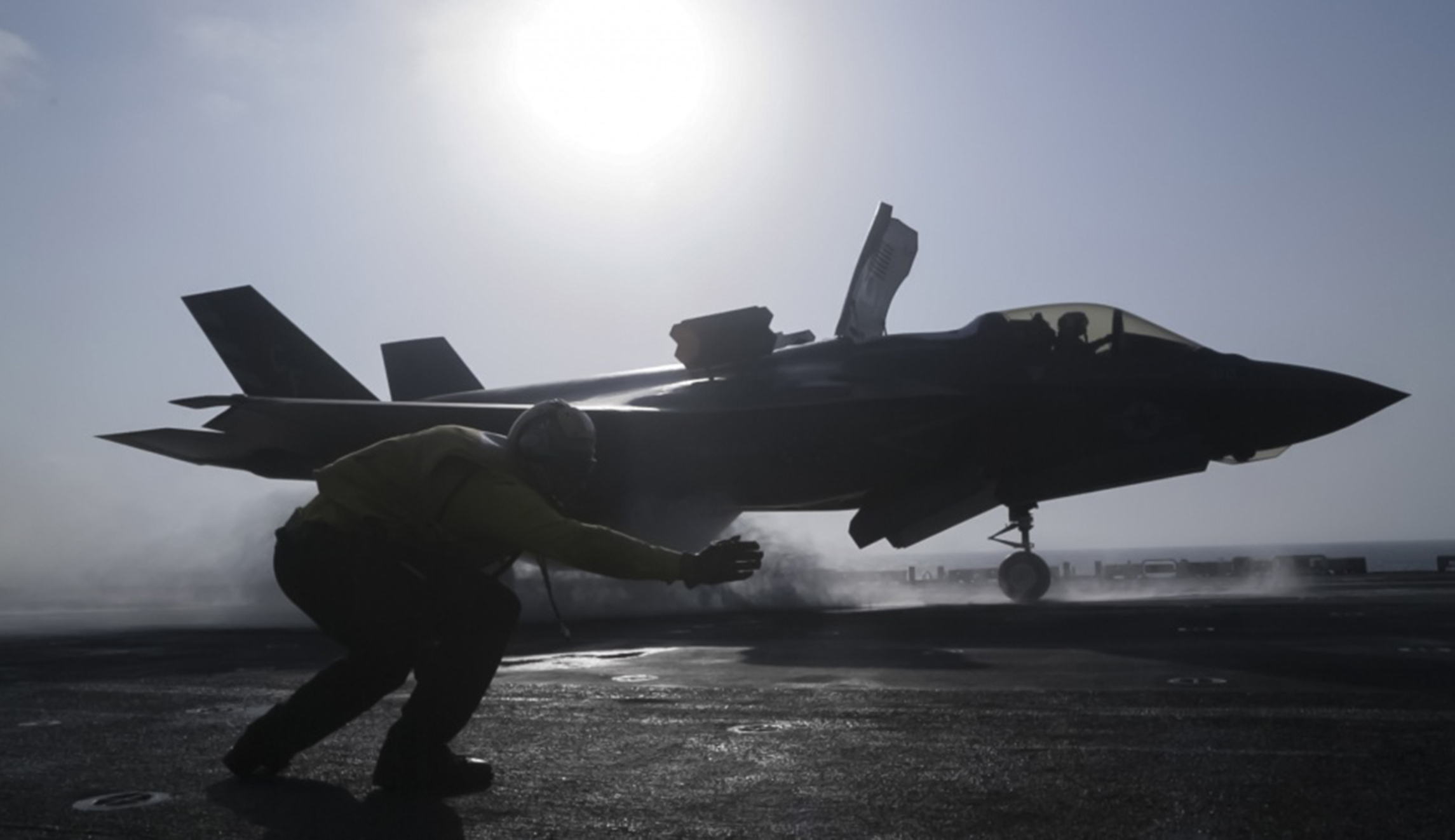 U.S. Navy Petty Officer 1st Class Rey White, an aviation boatswain's mate handler with the Essex Amphibious Ready Group, launches an F-35B Lightning II with Marine Fighter Attack Squadron 211, 13th Marine Expeditionary Unit, from the Wasp-class amphibious assault ship USS Essex, before the F-35B's first combat strike on Thursday.
