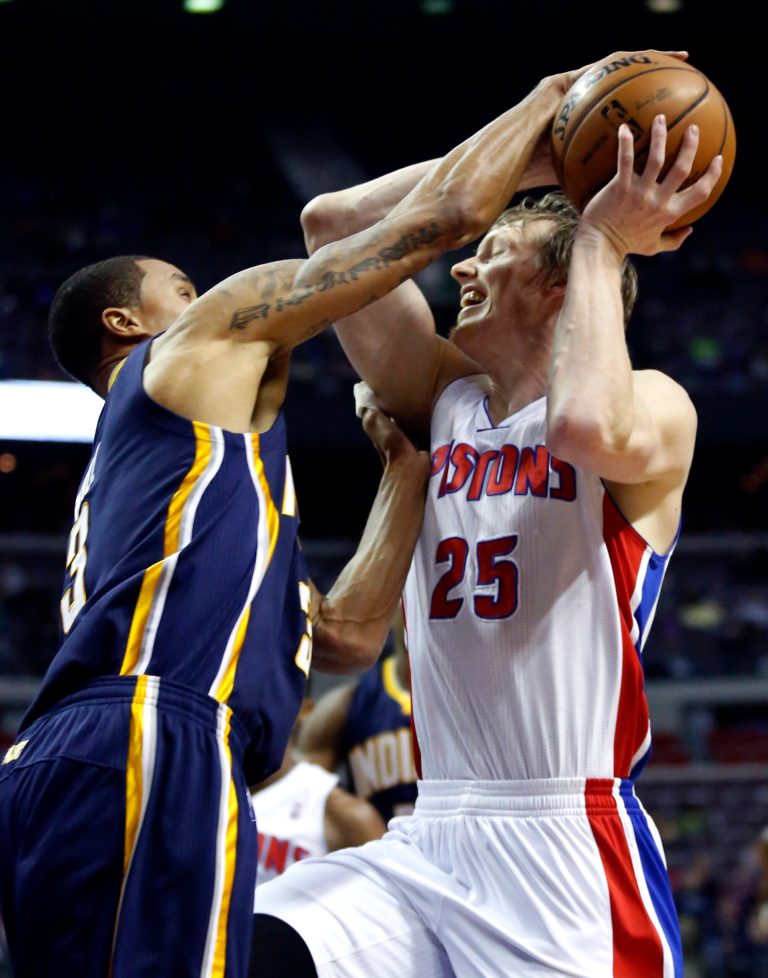   Detroit Pistons forward Kyle Singler (25) has his shot blocked by Indiana Pacers guard George Hill (3) in the first half of an NBA basketball game, Saturday, Dec. 15, 2012, in Auburn Hills, Mich. (AP Photo/Duane Burleson)  
