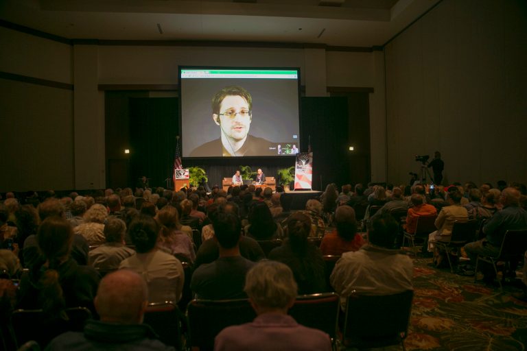 National Security Agency leaker Edward Snowden appears on a live video feed broadcast from Moscow at an event sponsored by the ACLU Hawaii in Honolulu on Saturday, Feb. 14, 2015. (AP Photo)Â 