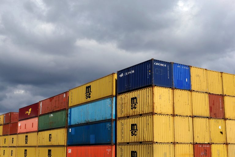 FILE - In this March 1, 2013 file photo containers sit in stacks after being unloaded from a ship at the Port of Baltimore's Seagirt Marine Terminal in Baltimore. The Commerce Department reports how much U.S. wholesale businesses adjusted their stockpiles in February later Wednesday April 9, 2014.(AP Photo/Patrick Semansky, File)