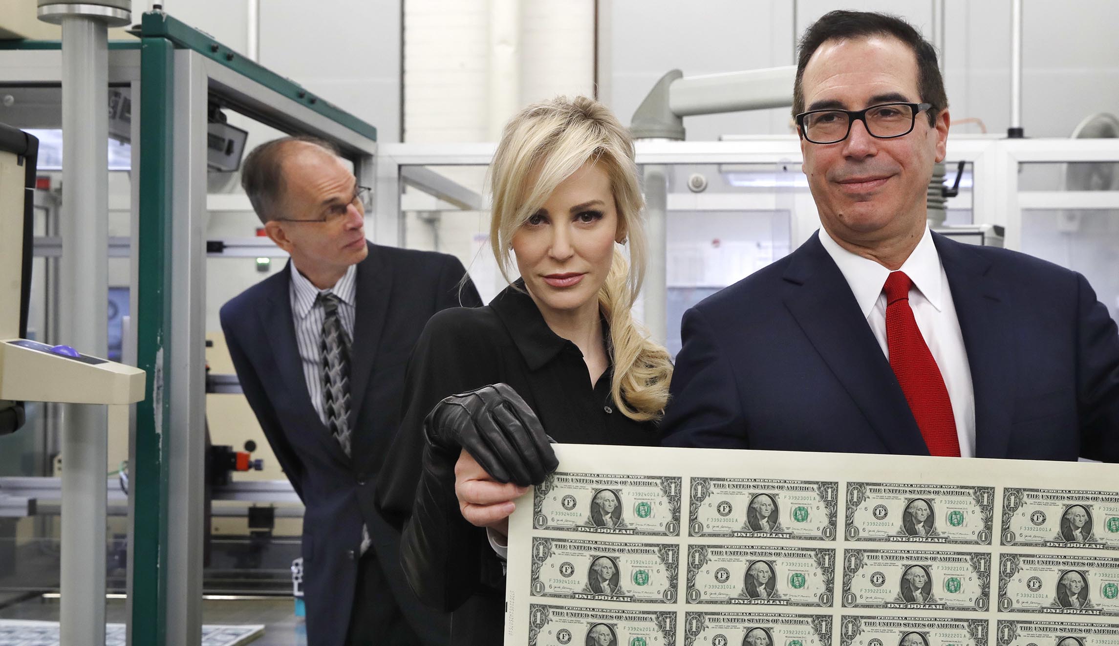 Treasury Secretary Steven Mnuchin gets first look at new $1 bills with his signature