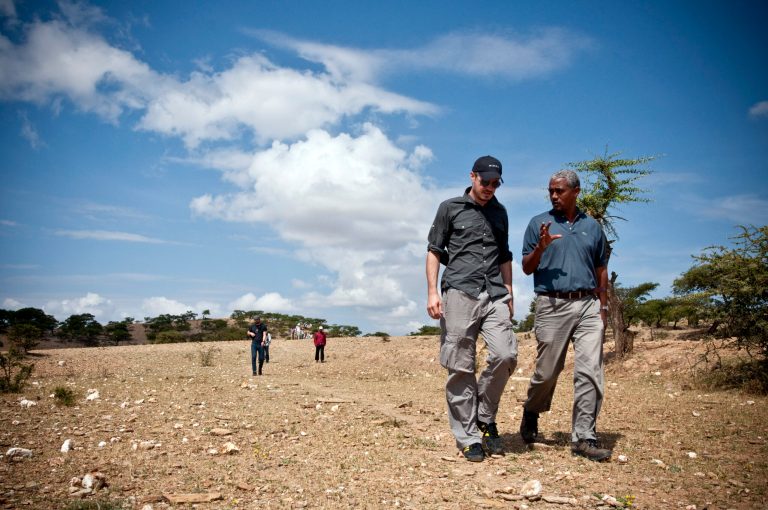   In this 2009 image provided by Charity: Water, Scott Harrison walks in a field in the northern region of Tigray in Ethiopia in 2009, as he visits a water project completed by local partner, Relief Society of Tigray. Harrison's organization has funded nearly 7,000 clean water projects in some of the poorest areas of the world. He wanted to add sensors to the wells to give donors more assurances about the projects. But raising millions of dollars for the innovation was a problem. Google stepped in with major funding to create and install sensors on 4,000 wells across Africa that will send back real-time data on the water flow. Experts say the new annual grants are a part of a growing trend in venture philanthropy from donors who see technology as an instrument for social change. (AP Photo/Charity: Water)  