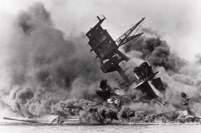 Attacking with the rising sun, wave after imperial wave of Japanese fighters and dive bombers strafed and torpedoed a sleeping U.S. Pacific Fleet at Pearl Harbor. (AP File Photo)