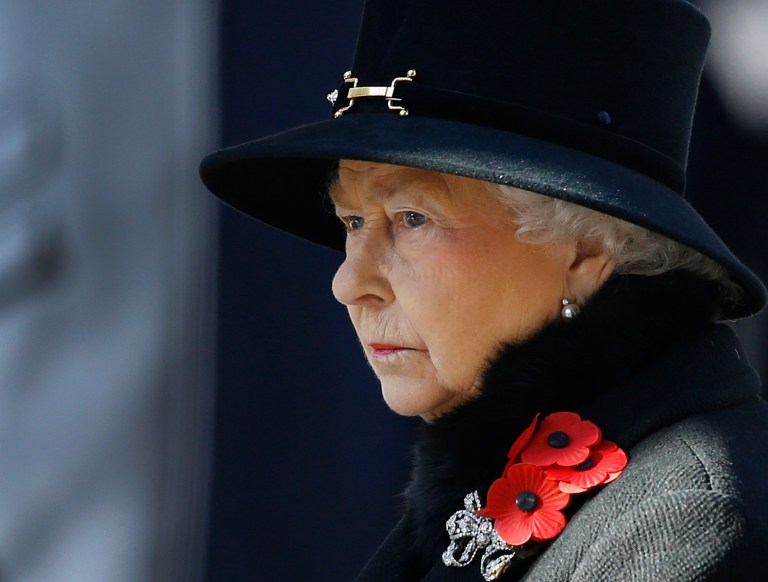 FILE - This  is a Sunday, Nov. 10, 2013 file photo of Britain's Queen Elizabeth II as she listens during the service of remembrance at the Cenotaph in Whitehall, London. A monarch's life is not all luxury and glamour. A report by British lawmakers into the finances of Queen Elizabeth II has exposed crumbling palaces and depleted coffers, and discovered that a royal reserve fund for emergencies is down to its last million pounds ($1.6 million). In the Tuesday Jan. 28, 2014, report the legislators urged royal officials to adopt a more commercial approach to making money, and suggested opening up Buckingham Palace to visitors more often. (AP Photo/Kirsty Wigglesworth)