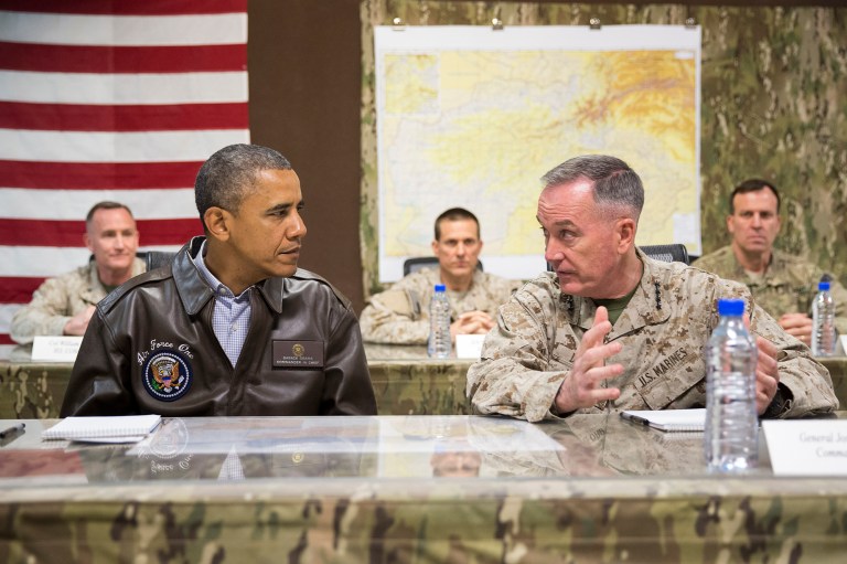 President Obama as he is briefed by Marine General Joseph Dunford, commander of the US-led International Security Assistance Force at Bagram Air Field. U.S. troops are in combat in Iraq, Syria and Afghanistan, and maybe in Somalia and Libya, too. (AP Photo/ Evan Vucci, File)