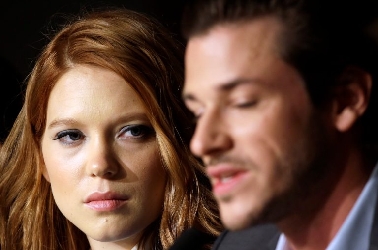Actress Lea Seydoux, left, listens to actor Gaspard Ulliel speak during a press conference for Saint-Laurent at the 67th international film festival, Cannes, southern France, Saturday, May 17, 2014. (AP Photo/Thibault Camus)