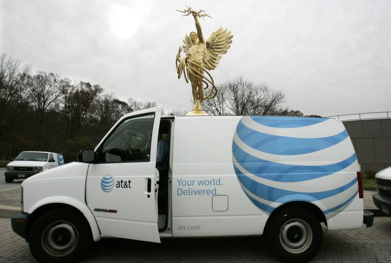 The AT&T Corp. is displayed on a panel truck with the company's Golden Boy statue in background, outside company offices in Bedminster, N.J., Monday, Nov. 21, 2005. (AP Photo/Mike Derer)