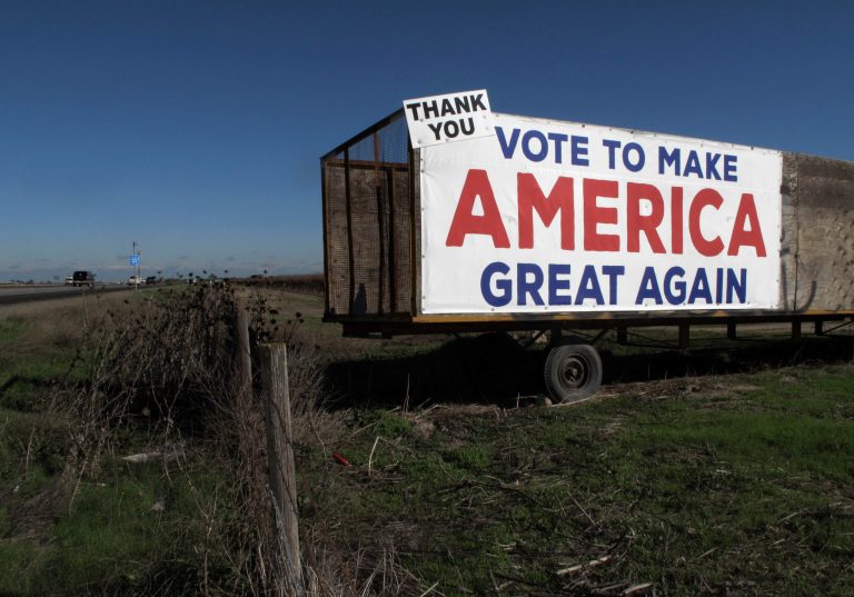 This Dec. 17, 2016 photo shows a Donald Trump campaign sign along a highway near Los Banos, Calif. A California farmer says Donald Trump's campaign vow to deport millions of immigrants who are in the country illegally pushed him into buying more equipment, cutting the number of workers he'll need during the next harvest. Others in California's farming industry say Trump's tough campaign talk targeting immigrants in the country illegally, including a vast number of farmworkers, spurred them into action, too. (AP Photo/Scott Smith)