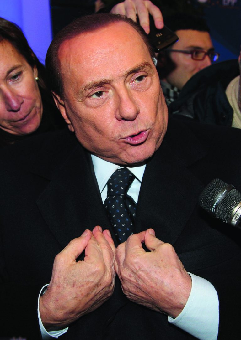 Italy's EPP party member Silvio Berlusconi talks to the media at the end of the European People's Party summit, ahead of the EU summit in Brussels on Thursday, Dec. 13, 2012. In one whirlwind morning, the European Union nations agreed on the foundation of a fully-fledged banking union and Greece's euro partners approved billions of euros in bailout loans that will prevent the nation from going bankrupt. (AP Photo/Yves Logghe)