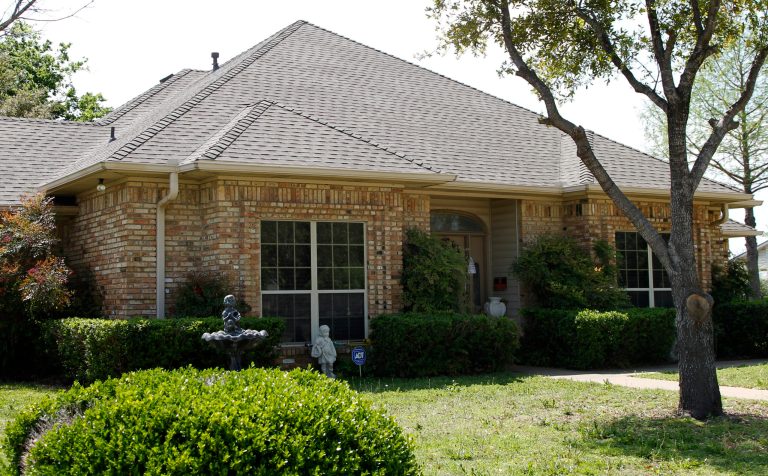 File - In this April 15, 2013 file photo, the home of Eric Lyle Williams is shown in Kaufman, Texas. Texas authorities have arrested the former justice of the peace's wife, Kim Lene Williams. Online jail records do not list charges against her and officials in Kaufman County wouldn't immediately comment on the reason for her arrest. A law enforcement official has said authorities are trying to build a case against Eric Lyle Williams in the deaths of Kaufman County District Attorney Mike McLelland and his wife, Cynthia. (AP Photo/Tony Gutierrez, File)