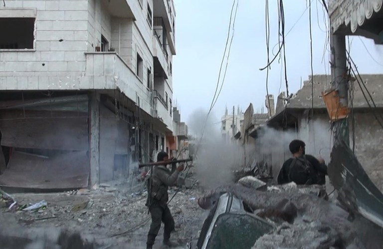 This undated photo posted on Monday, Nov. 4, 2014 by the Raqqa Media Office of the Islamic State group, a militant extremist group, shows fighting in Kobani, Syria.(AP Photo/Raqqa Media Office)