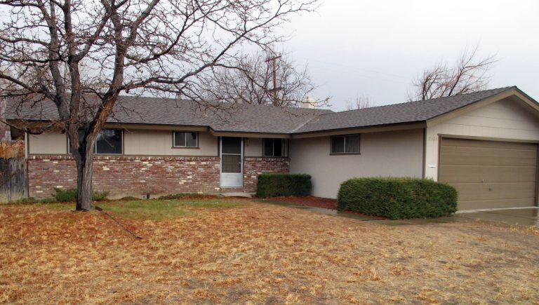   More than $7.4 million worth of gold coins, bars and bullion was left behind in the garage of Walter Samaszko Jr.'s home in Carson City, Nev. after his death in June. The home in a modest neighborhood a couple miles north of the state capital was sold at auction for $112,000 earlier this year and was sitting vacant in this photograph taken Monday, Dec. 17, 2012. (AP Photo/Scott Sonner)  
