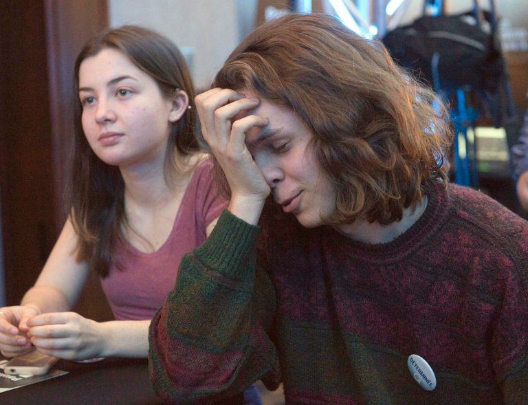 Parti Quebecois supporters react as they watch early election results at the party's reception, Monday, April 7, 2014, in Montreal. The Liberal Party won Quebec's legislative elections Monday, in a crushing defeat for the main separatist party and major setback for the cause of independence in the French-speaking province. Official results showed the Liberals, staunch supporters of Canadian unity, won or were leading the race in about 75 of the of National Assembly's 125 seats, outstripping the separatist Parti Quebecois. (AP Photo/The Canadian Press, Ryan Remiorz)