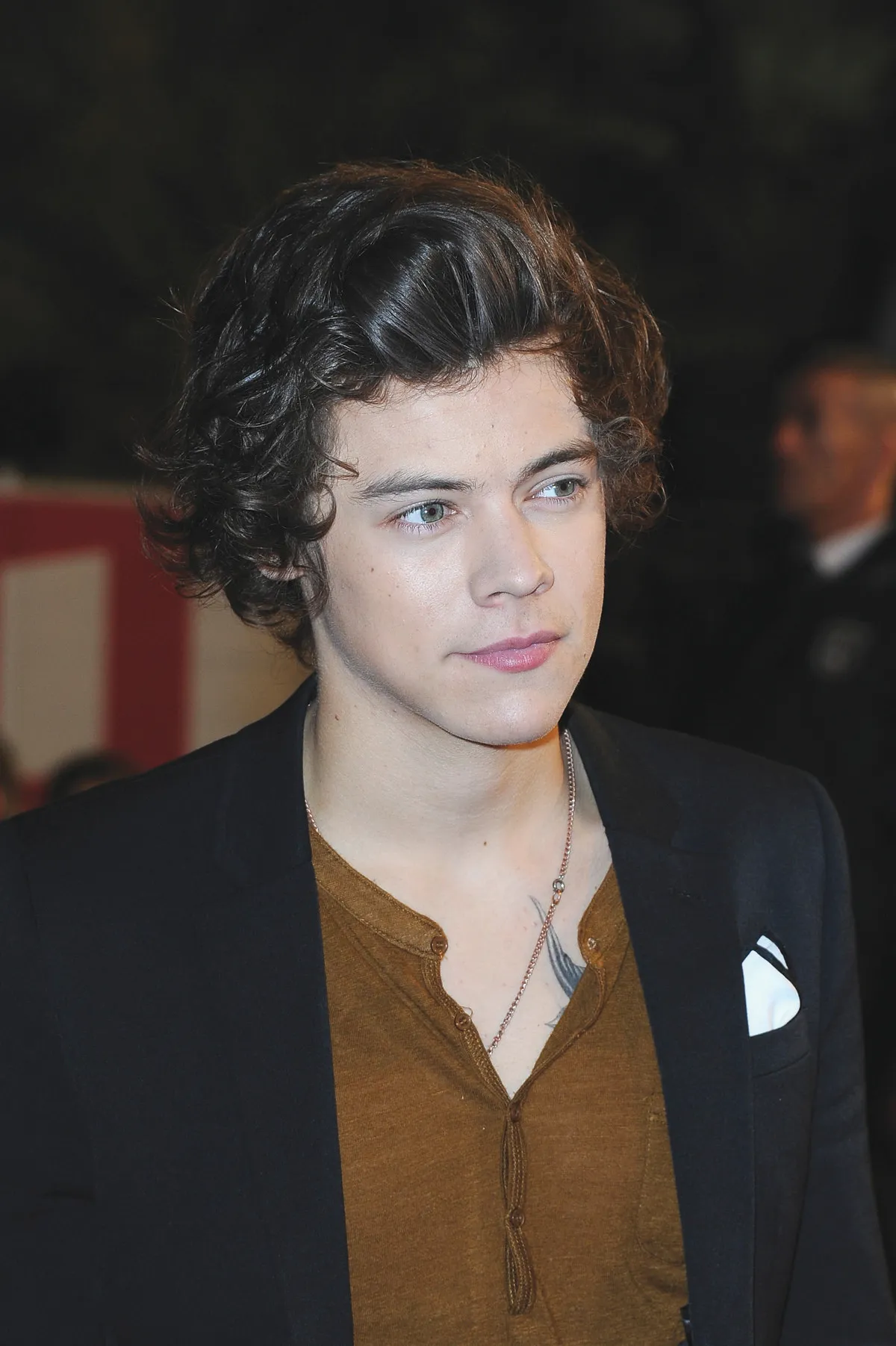 The Buzz: Harry debuts giant butterfly tattoo on his chest