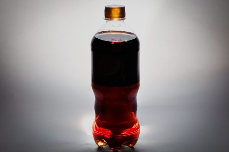A bottle of soda is photographed in Washington Thursday, Jan. 23, 2014. The Food and Drug Administration (FDA) says it is conducting new studies of the safety of caramel coloring in soft drinks and other foods, even though previous research has shown no identifiable health risk. The agency's announcement comes in response to a study by Consumer Reports that shows varying levels of 4-methylimidazole _ an impurity formed in some caramel coloring at low levels during the manufacturing process _ in 12 brands of soda from five manufacturers. (AP Photo/J. David Ake)