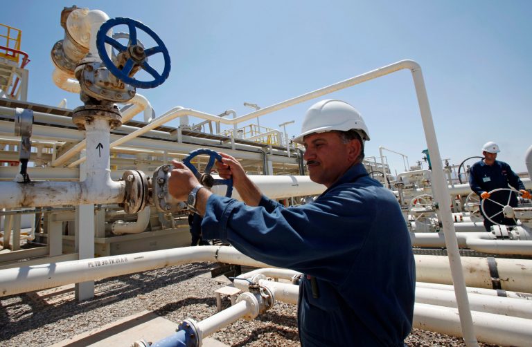   FILE - In this May 31, 2009 file photo, an employee works at the Tawke oil fields in the semiautonomous Kurdish region in northern Iraq. An Iraqi Kurdish official says the country's self-ruled northern Kurdish region has suspended oil exports over a payment row with the central government in Baghdad. (AP Photo/Hadi Mizban, File)  