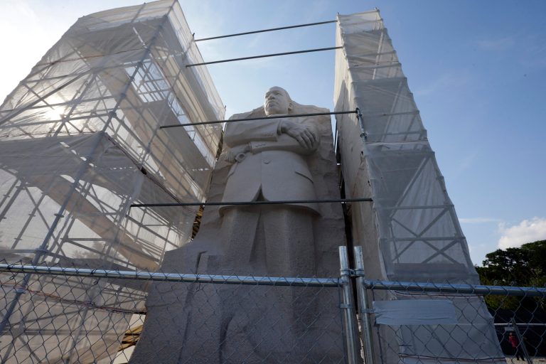   The Martin Luther King, Jr. Memorial has shrouded scaffolding on both sides, Monday, Aug. 12, 2013 in Washington. A contracting problem has stalled work to refinish part of the Martin Luther King Jr. Memorial where a disputed inscription was recently removed, which might delay the projectâs completion until after the 50th anniversary of the March on Washington. (AP Photo/Alex Brandon)  