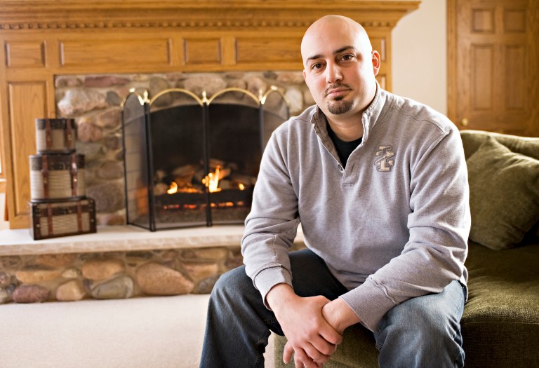 This photo taken in 2011 shows Abe Mashal posing for a photo at his  home in  St. Charles, Ill. The Obama administration is promising to change the way travelers can ask to be removed from its no-fly list of suspected terrorists banned from air travel. One of the plaintiffs in the Portland lawsuit, Abe Mashal, was unable to print his boarding pass before a flight out of Chicago four years ago. A counter representative told him he was on the no-fly list and would not be allowed to board. Mashal was surrounded by about 30 law enforcement officials, he said. (AP Photo/Sun-Times Media)  MANDATORY CREDIT, MAGS OUT,