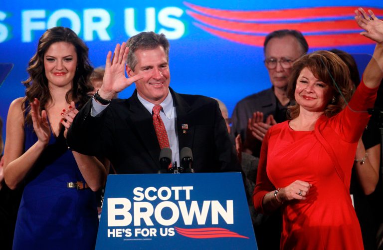 U.S. Sen. Scott Brown, R-Mass., center, waves to the crowd at the conclusion of a concession speech as his daughter Ayla Brown, left, applauds and wife Gail Huff, right, waves at an election night watch party in a hotel in Boston, Tuesday, Nov. 6, 2012. Brown lost to Democratic challenger Elizabeth Warren in his bid for re-election to the U.S. Senate. (AP Photo/Steven Senne)