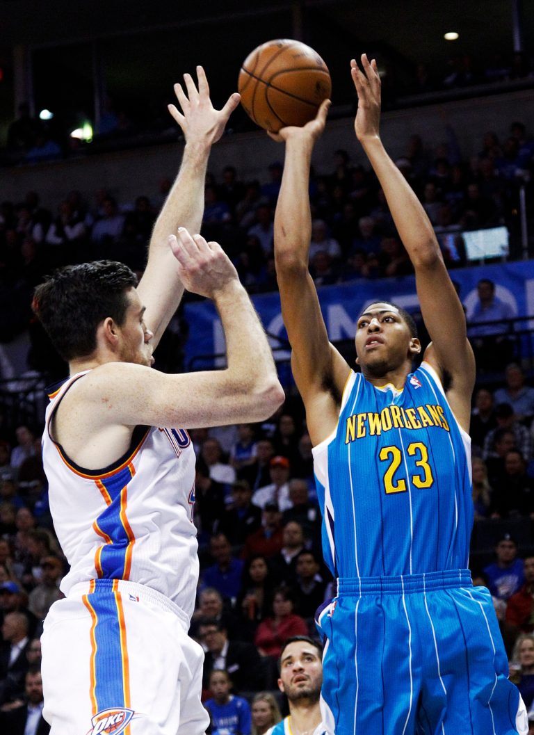   New Orleans Hornets' Anthony Davis (23) shoots over Oklahoma City Thunder forward Nick Collison (4) in the first quarter of an NBA basketball game in Oklahoma City, Wednesday, Dec. 12, 2012. (AP Photo/Sue Ogrocki)  