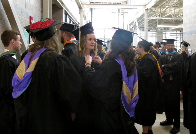 Carroll College students prepare for their graduation ceremony in Helena, Mont. (AP Photo/Matt Volz)