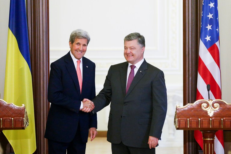 U.S. Secretary of State John Kerry met with Ukrainian President Petro Poroshenko in Kiev, Ukraine. The U.S. said Thursday that it will give nearly $23 million in additional humanitarian aid to Ukraine. (AP Photo/Sergei Chuzavkov)
