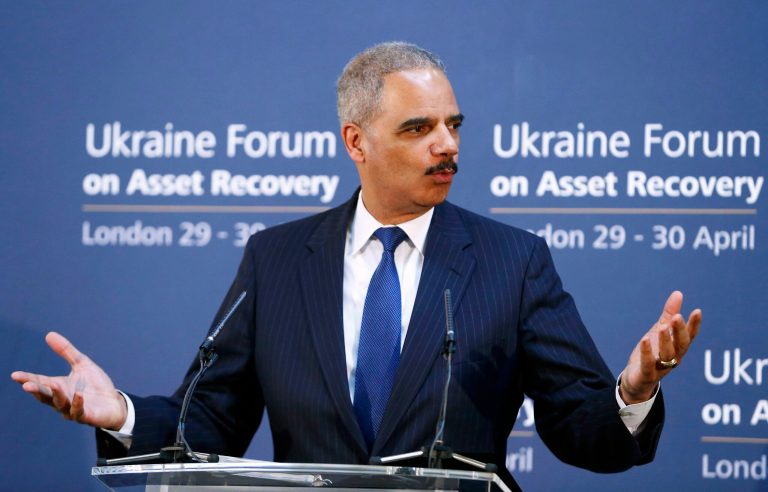 U.S. Attorney General Eric Holder speaks at the Ukraine Forum on Asset Recovery in central London, Tuesday April 29, 2014. Britain and the United States are co-hosting the two-day 