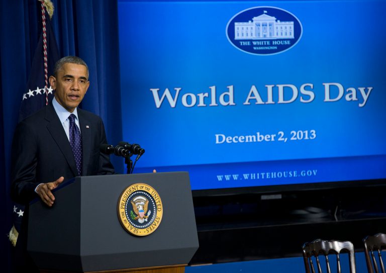 President Barack Obama gestures while speaking at a world AIDS Day event, Monday, Dec. 2, 2013, in the South Court Auditorium on the White House complex in Washington. (AP Photo/ Evan Vucci)