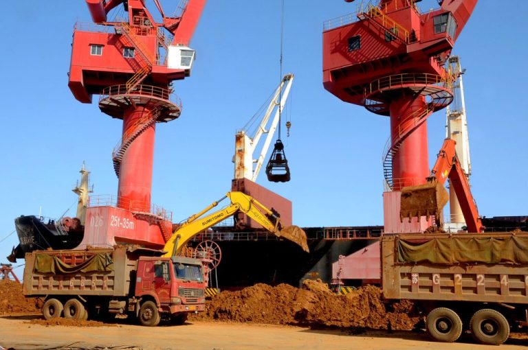 Excavators load trucks with rare earth on a quay at the Port of Lianyungang, in Lianyungang city, east China's Jiangsu province. The future direction of the coal industry is aimed at harvesting what are known as 