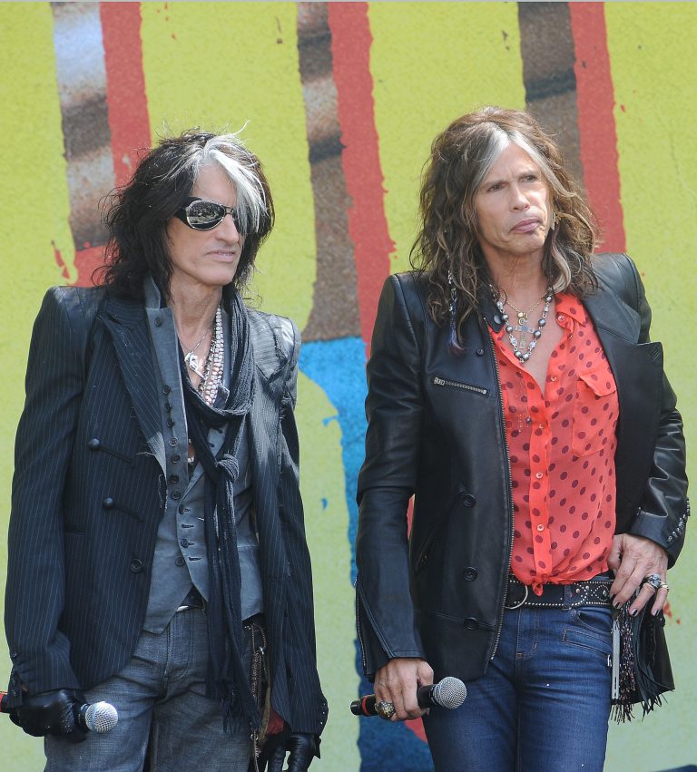   FILE - This March 28, 2012 file photo shows Joe Perry, left, and Steven Tyler from the band Aerosmith at a news conference announcing their 2012 Global Warming Tour at The Grove in Los Angeles. The Global Warming Tour will begin on June 16, in Minneapolis. (AP Photo/Katy Winn, file)  