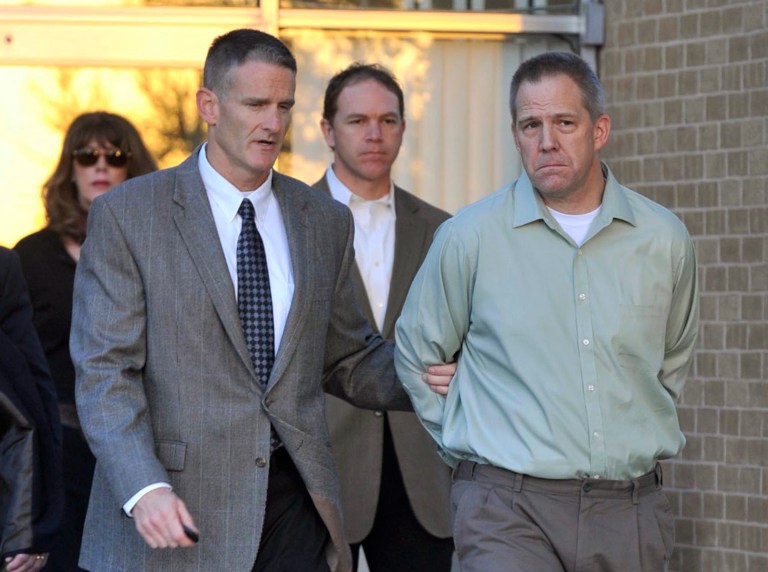   FILE - In this April, 2, 2012 file photo, JetBlue pilot Clayton Frederick Osbon, right, is escorted by FBI agents as he is released from The Pavilion at Northwest Texas Hospital in Amarillo, Tex. Ten passengers filed a lawsuit, Wednesday, June 13, 2012 in Garden City, N.Y. against JetBlue over the flight during which Osbon had to be physically restrained after after running through the cabin yelling about Jesus and al-Qaida during a New York-to-Las Vegas flight in March.They claim the airline was 