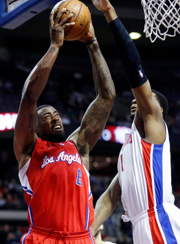   Los Angeles Clippers center DeAndre Jordan (6) goes to the basket against Detroit Pistons forward Andre Drummond (1) in the first half of an NBA basketball game in Auburn Hills, Mich., Monday, Nov. 17, 2012. (AP Photo/Duane Burleson)  
