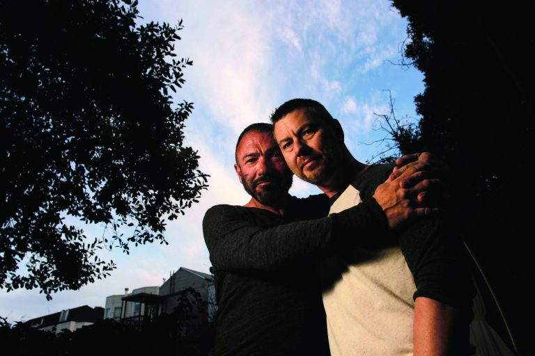 In this photo taken Jan. 4, 2012, Bradford Wells, left, and Anthony John Makk pose together at their home in San Francisco. Wells and Makk, are a married gay couple that have lived most of their 19 years of relationship in San Francisco. Makk is a citizen of Australia married to Wells, a U.S. citizen who suffers from AIDS-related illness. Makk is his primary caregiver. The Department of Homeland Security plans to instruct its field offices next week illegal immigrants with same-sex partners or spouses are eligible for consideration under a federal program designed to focus resources away from low-priority deportation cases. Secretary Janet Napolitano has told Democratic lawmakers that binational gay couples who are married or in long-term relationships will be defined as having the family ties government lawyers can cite as grounds for dropping deportation proceedings. (AP Photo/San Francisco Chronicle, Michael Macor)