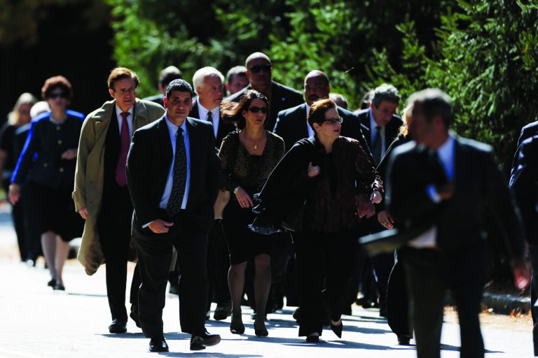 Mourners walk to Har Zion Temple for former U.S. Sen. Arlen Specter's funeral, Tuesday, Oct. 16, 2012, in Penn Valley, Pa. Family members say Specter died Sunday of complications from non-Hodgkin lymphoma. He was 82. (AP Photo/Matt Rourke)
