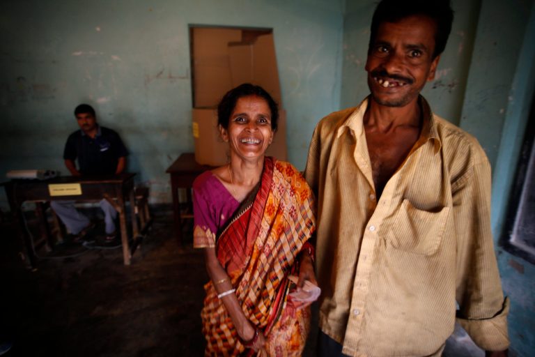 An Indian couple smile as they come out of a polling booth after casting their votes during the first phase of elections in Agartala, in the northeastern Indian state of Tripura, India, Monday, April 7, 2014.  The Indian national elections will be held over several weeks in phases to ensure safe and fair elections. (AP Photo/Saurabh Das)