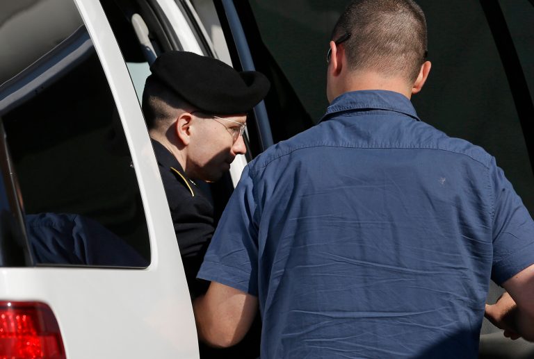 Army Pfc. Bradley Manning steps out of a security vehicle as he is escorted into a courthouse in Fort Meade, Md., on Tuesday before a hearing in his court martial. (AP/Patrick Semansky)