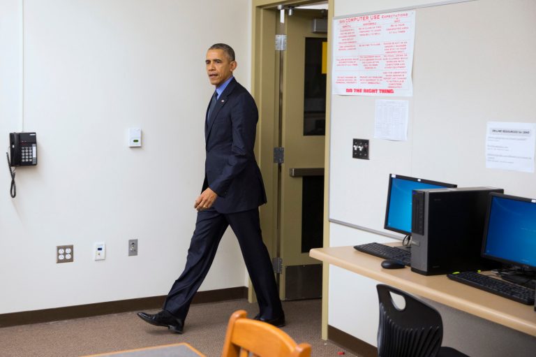 The Obamas spoke with 14 groups of family members in the school's library, going from table to table. (AP Photo/Evan Vucci)