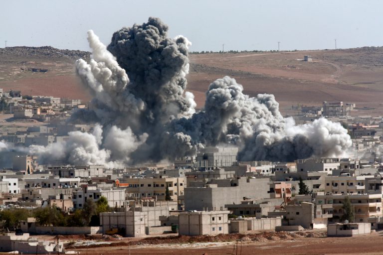 Thick smoke from an airstrike by the US-led coalition rises in Kobani, Syria. The Islamic State group may be sprouting tentacles across the region but it is struggling in Syria, part of its heartland, where it has stalled or even lost ground in fighting with multiple enemies on multiple fronts. (AP Photo/Lefteris Pitarakis, File)
