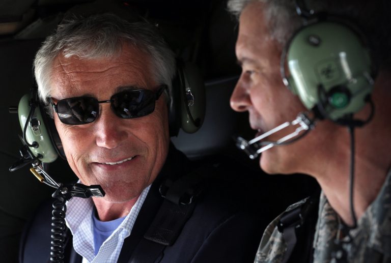U.S. Secretary of Defense Chuck Hagel, left, talks to Commander of U.S. Force Japan Lt. Gen. Salvatore 