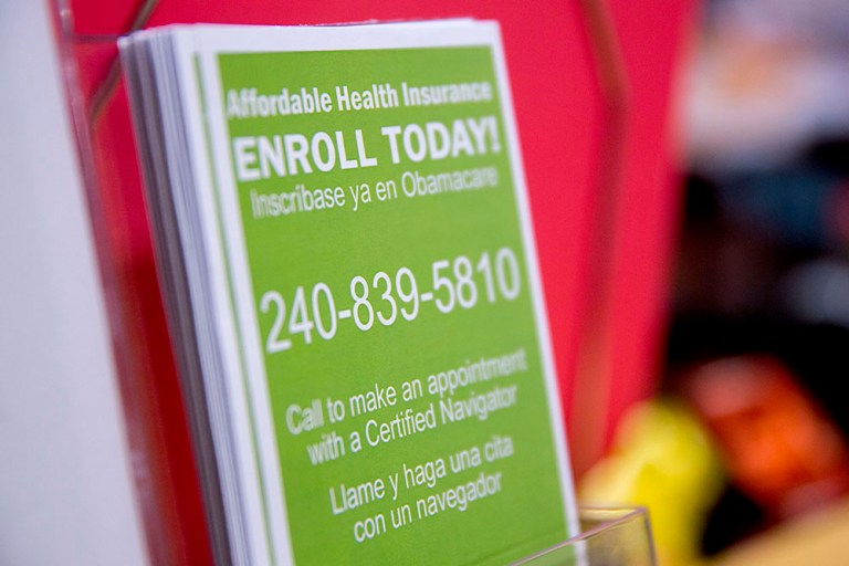 An Obamacare enrollment informational pamphlet sits on display at a Community Clinic Inc. health center. Major insurers in the next few weeks will give a crucial report on how they are faring in Obamacare this year. (Bloomberg/Andrew Harrer)