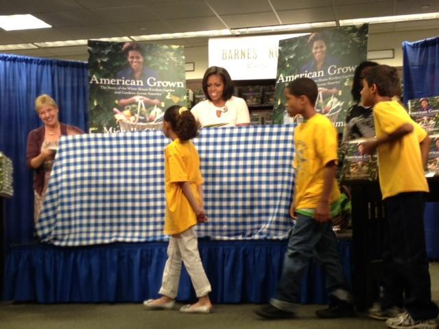 Michelle Obama signs some books