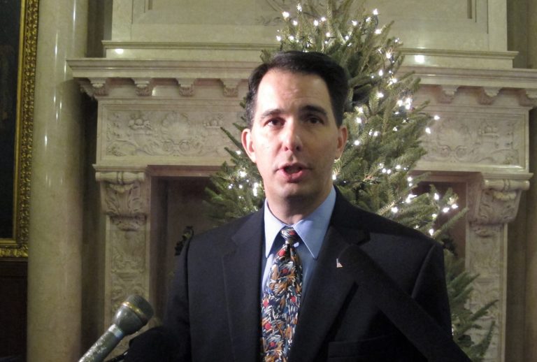 Wisconsin Gov. Scott Walker reiterates that he'd prefer the Legislature not take up a right-to-work bill, but he also refused to promise a veto on Friday, Dec. 5, 2014, in Madison, Wis. (AP Photo/Scott Bauer)