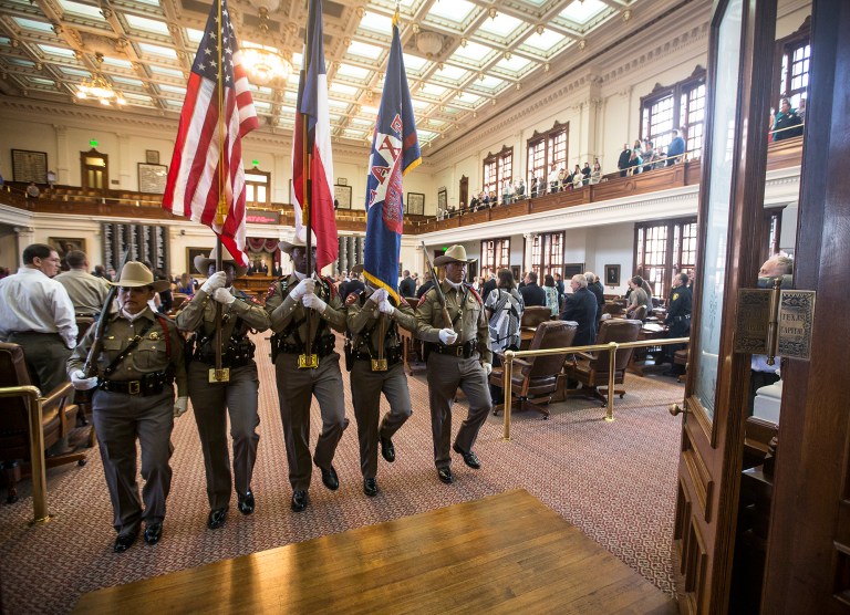 Members of the Texas Highway Patrol Honor Guard hold flags during the Stars of Texas awards ceremony at the State Capitol in Austin, Texas on Wednesday, Sept. 3, 2014. (AP Photo/Austin American-Statesman, Ricardo B. Brazziell)