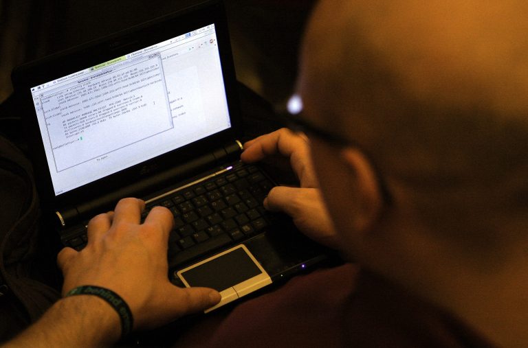A participant looks at lines of code on a laptop on the first day of the 28th Chaos Communication Congress (28C3) - Behind Enemy Lines computer hacker conference on December 27, 2011 in Berlin, Germany. (Photo by Adam Berry/Getty Images)