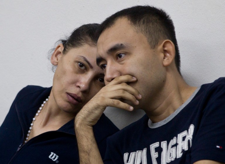  Mexican citizens Raquel Alatorre Correa, left, and Valentin Delgado, alleged members of an organized crime group, speak during their hearing in Managua, Nicaragua, Wednesday, Dec. 19, 2012. Correa, Delgado and other alleged members of the group, who are facing charges of organized crime and money laundering, were detained on Aug. 24 in Las Manos, Nicaragua, while they were traveling inside a Televisa TV truck with 